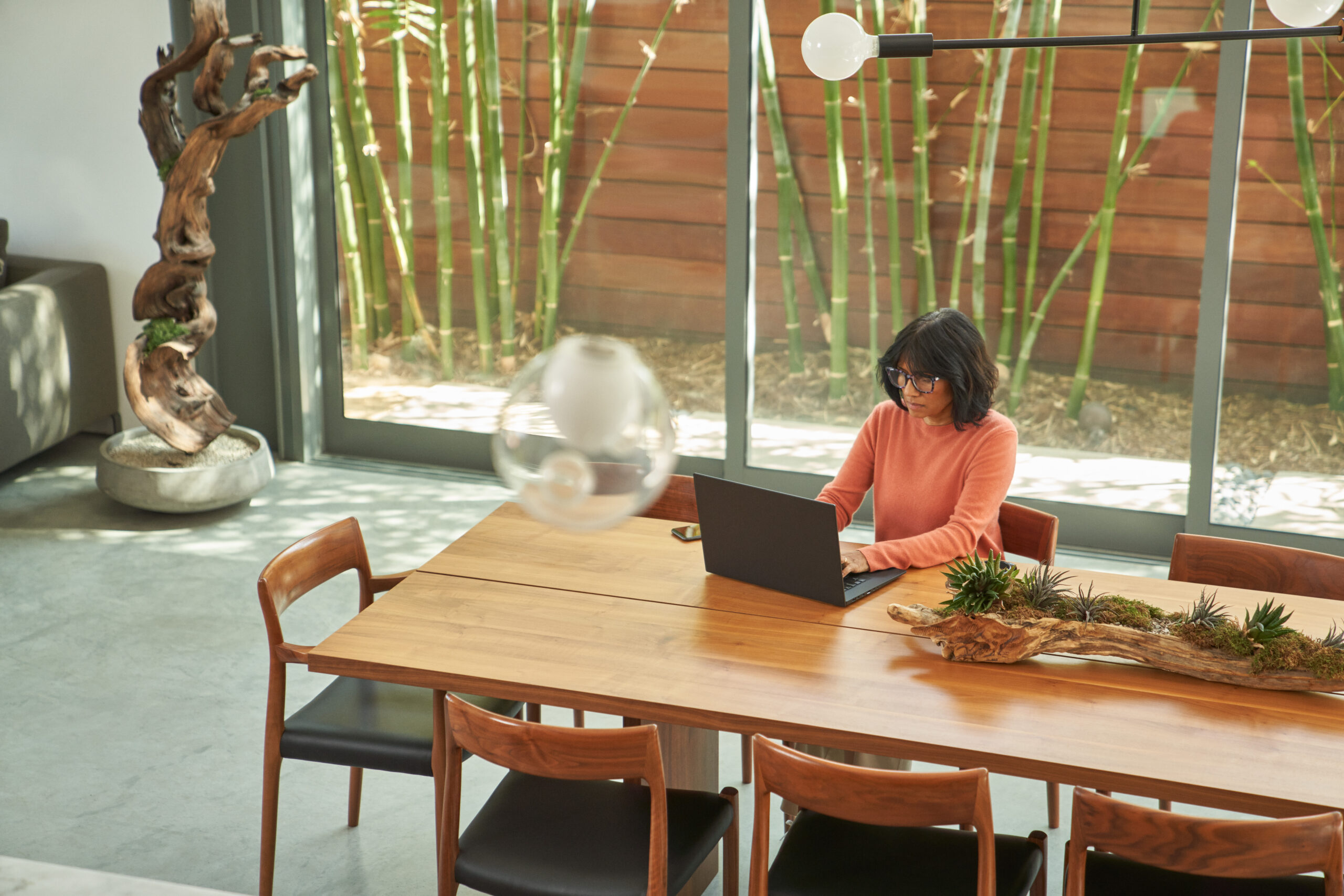 Photo of a seller working on a laptop at home