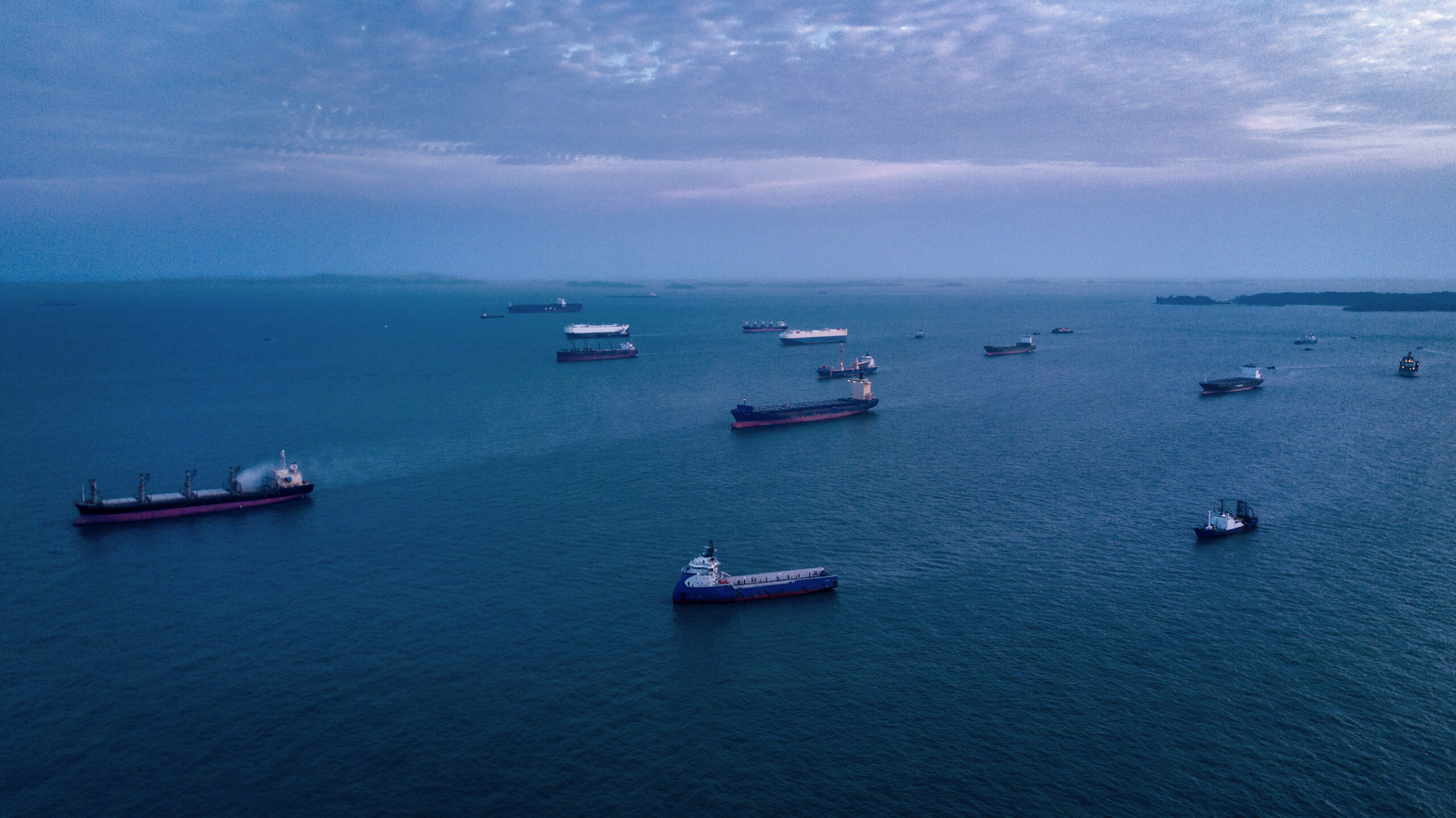 Photo of container ships waiting to dock in Singapore harbor