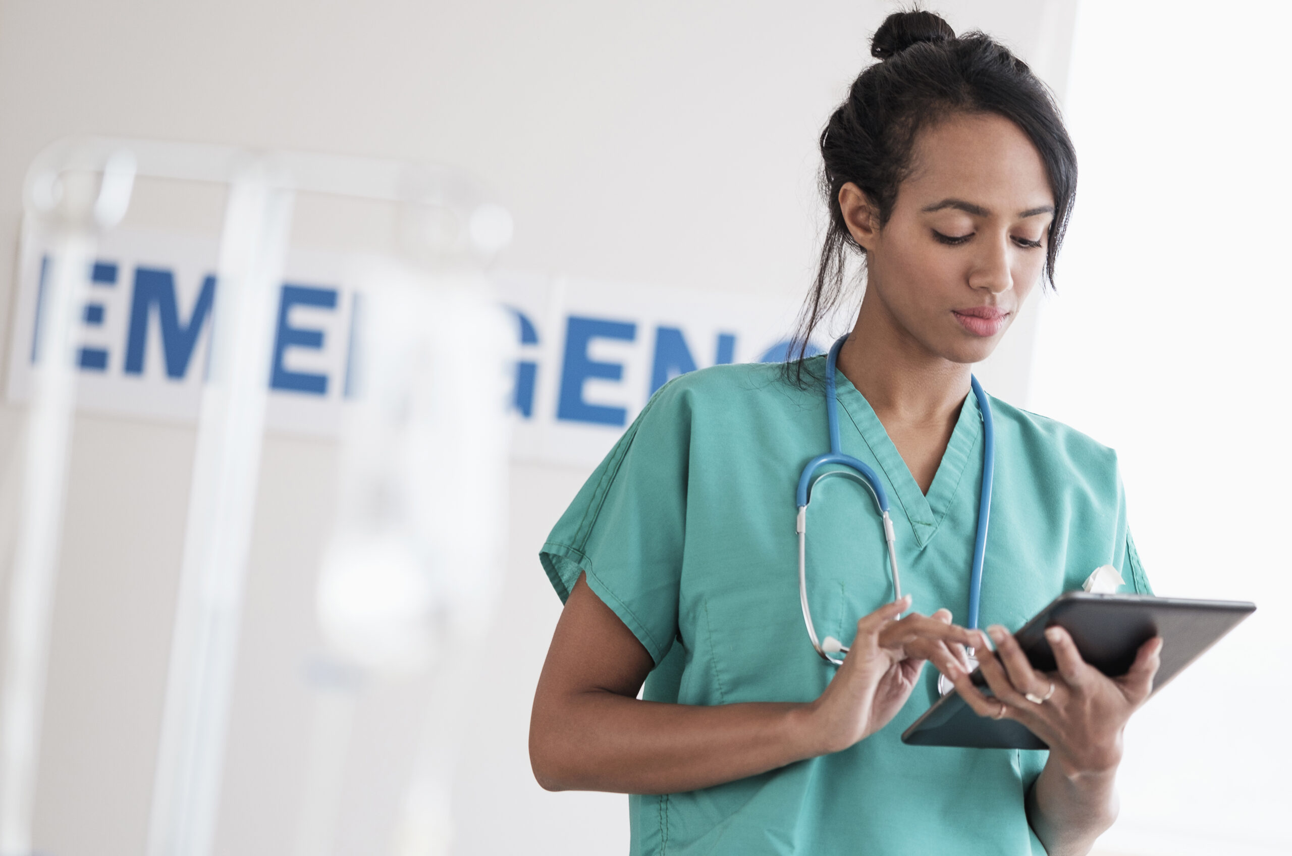 Nurse using a tablet for documentation in an emergency department