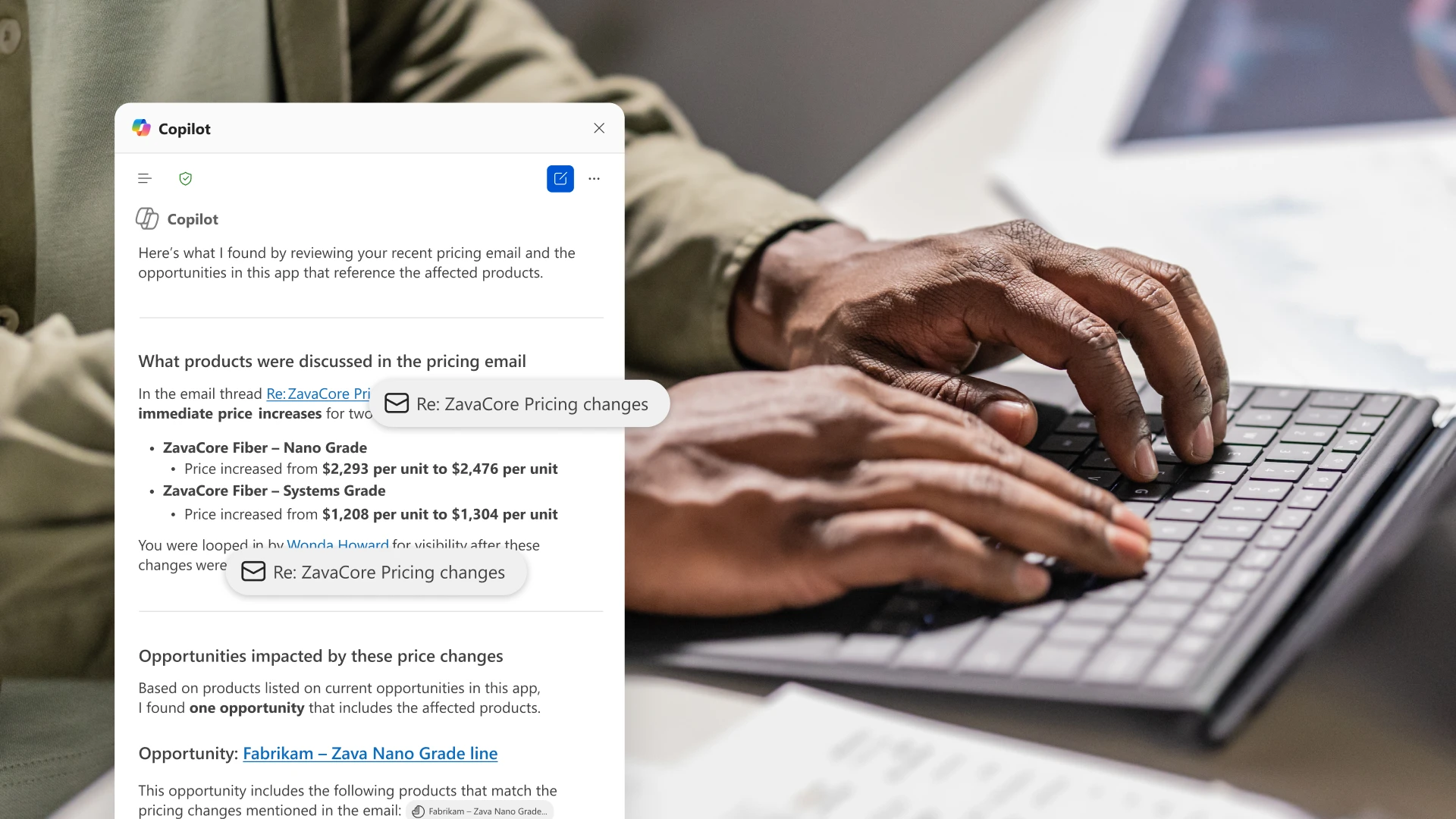 Person typing on a keyboard with a Copilot product UI screenshot on the side