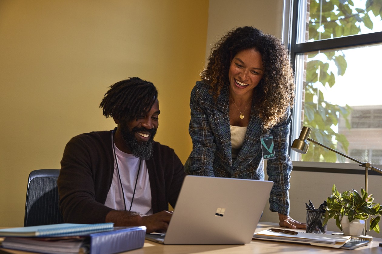 Two education leaders collaborating in an office at an educational institution