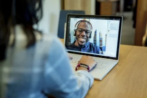 A person on a Teams call on a Surface device. Zero trust security makes it easier to be productive