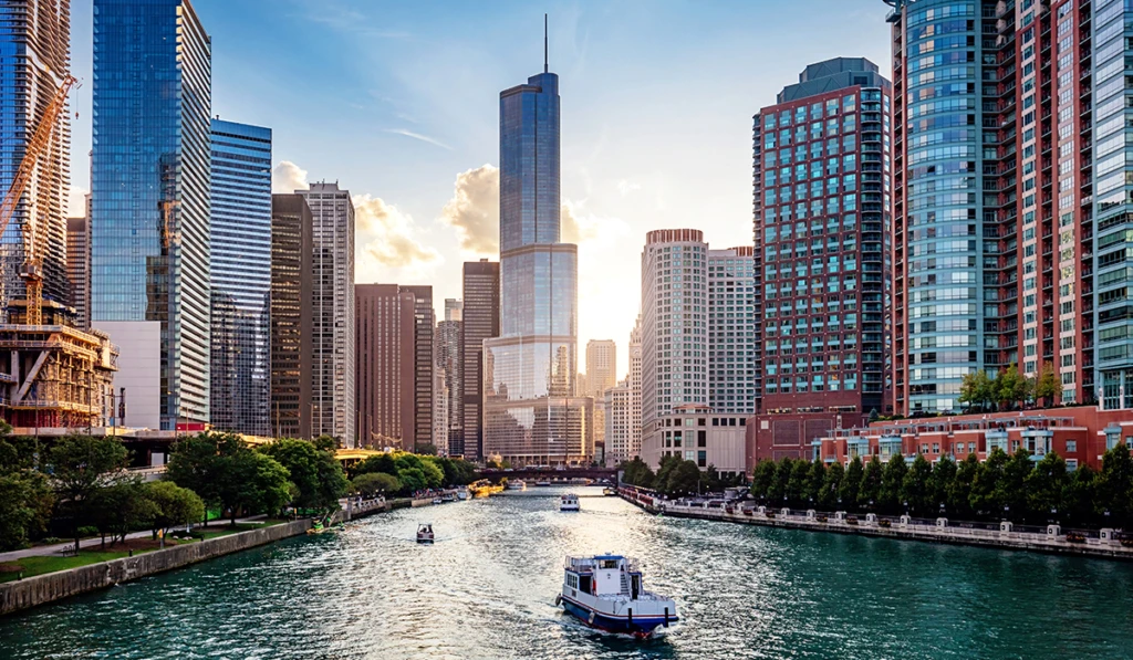 a large body of water with a city in the background