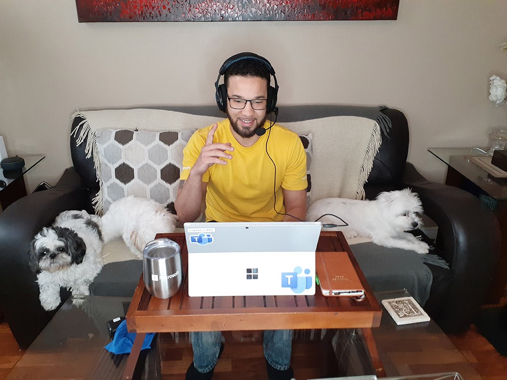 Carl Richardson works from home next to his dogs Diamond, Beauty and Benny.