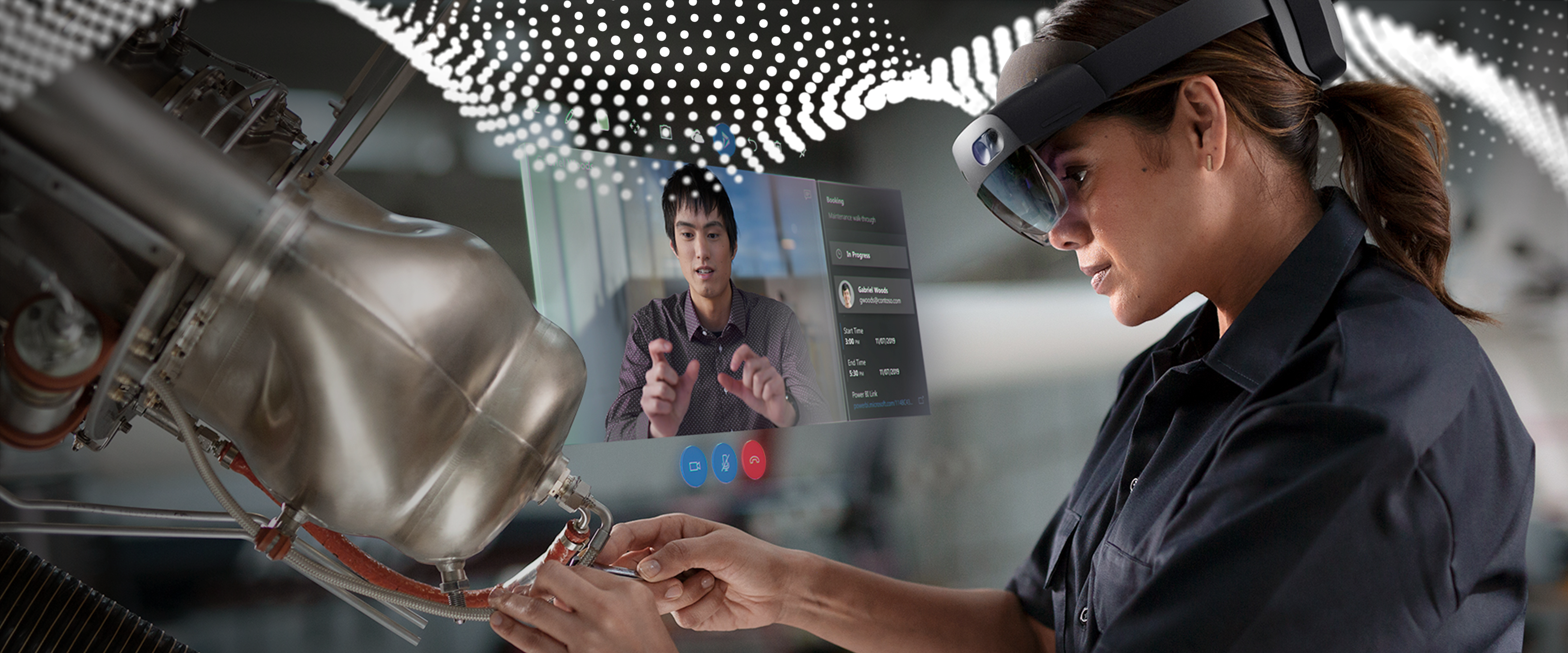 person wearing AR headset while working on a piece of machinery. Another person is on a screen observing