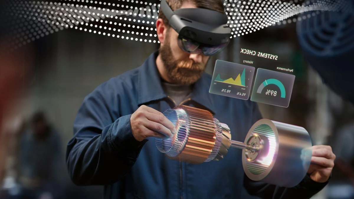 Man in manufacturing plant accessing data via Microsoft Azure. Contains hologram scenario