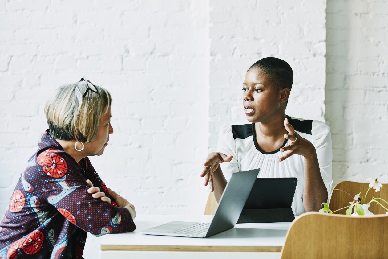 Two business professionals discussing strategy
