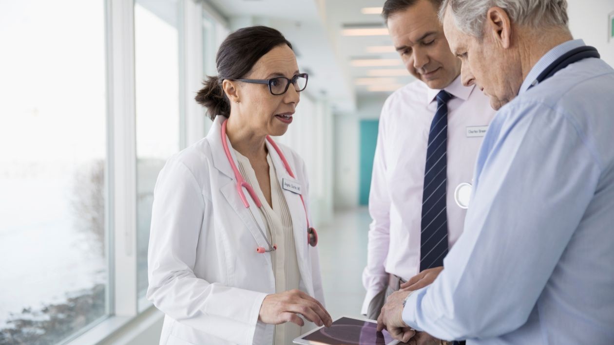 A group of healthcare workers talking in a hospital
