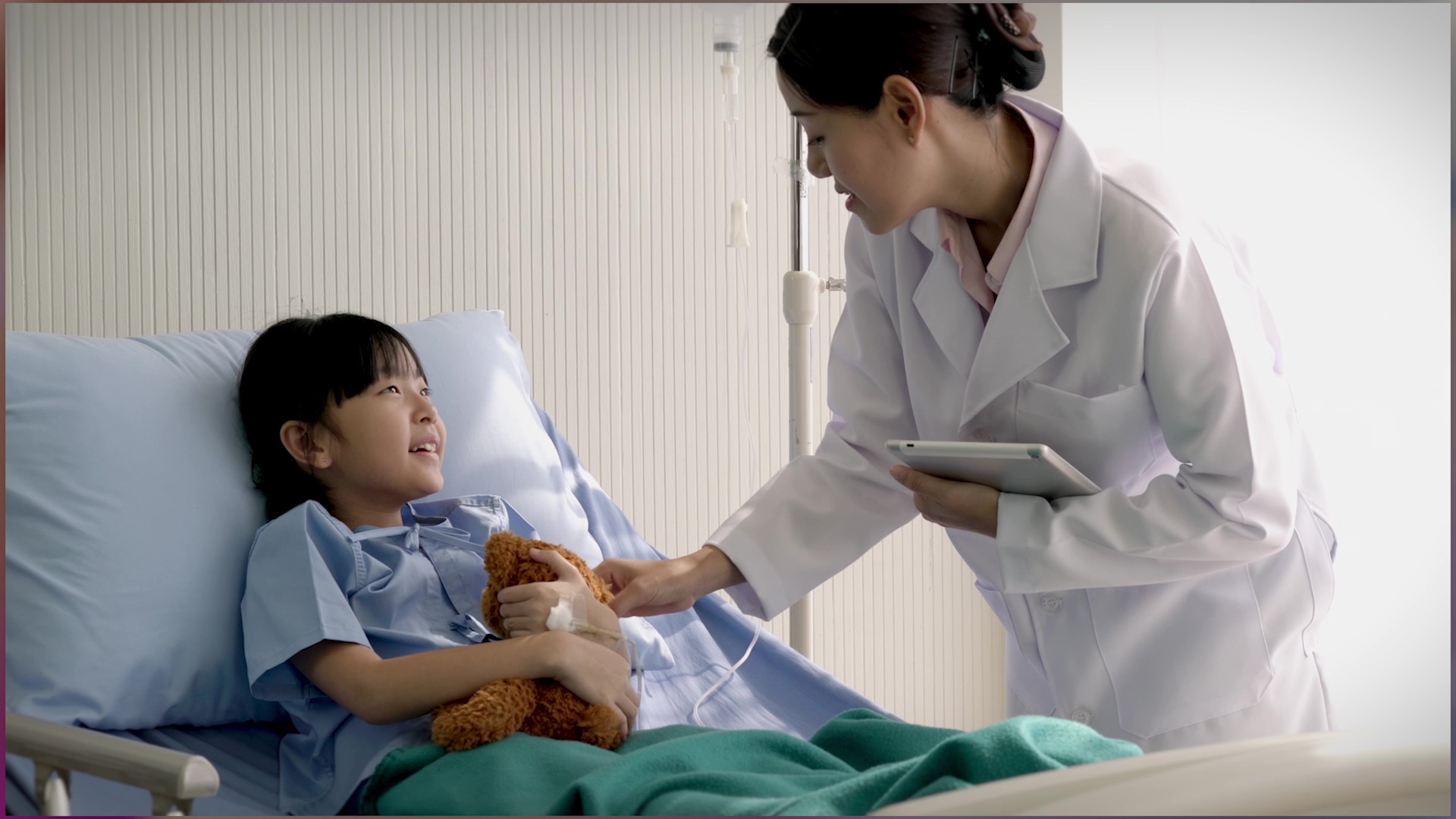 A young patient smiles at her doctor