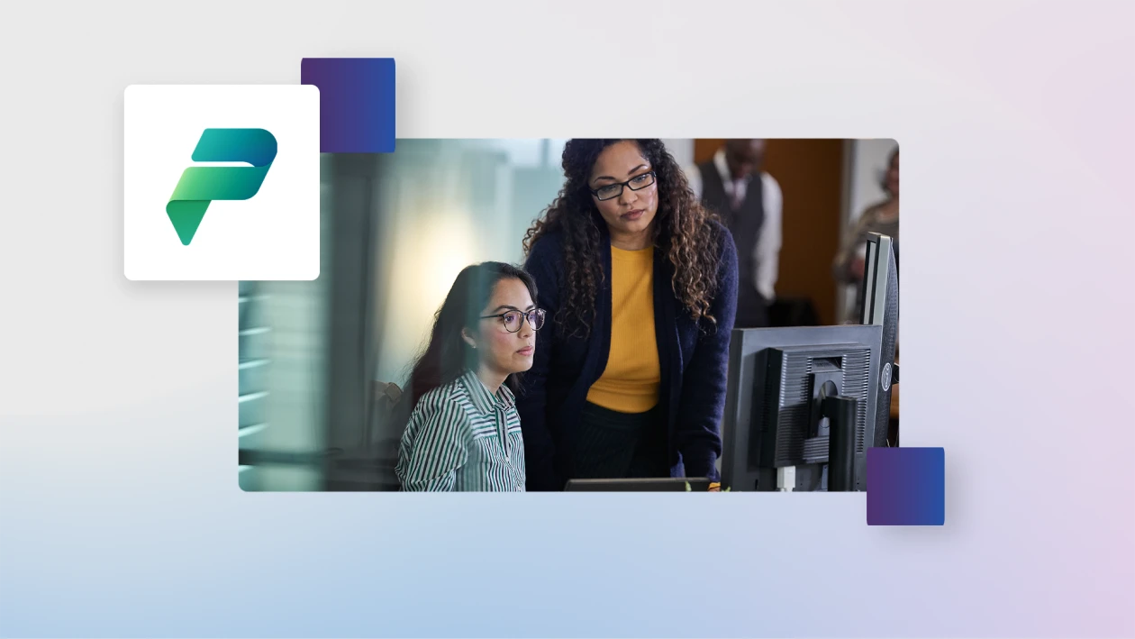 One person standing at the desk of another person sitting, looking at a computer, in an office. The image is overlaid on a soft blue gradient background incorporating the Microsoft Power Platform icon