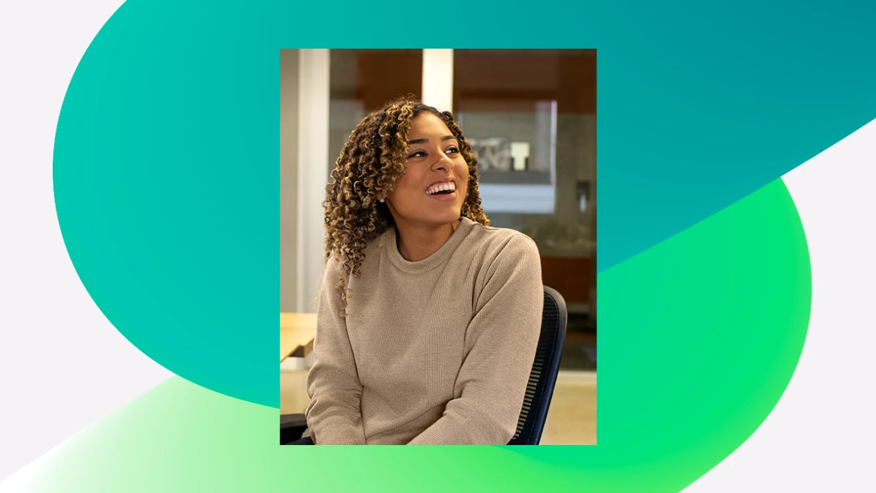 A person sitting in a chair, looking off to the side and smiling. The image of the person is overlaid on a green squiggly design background