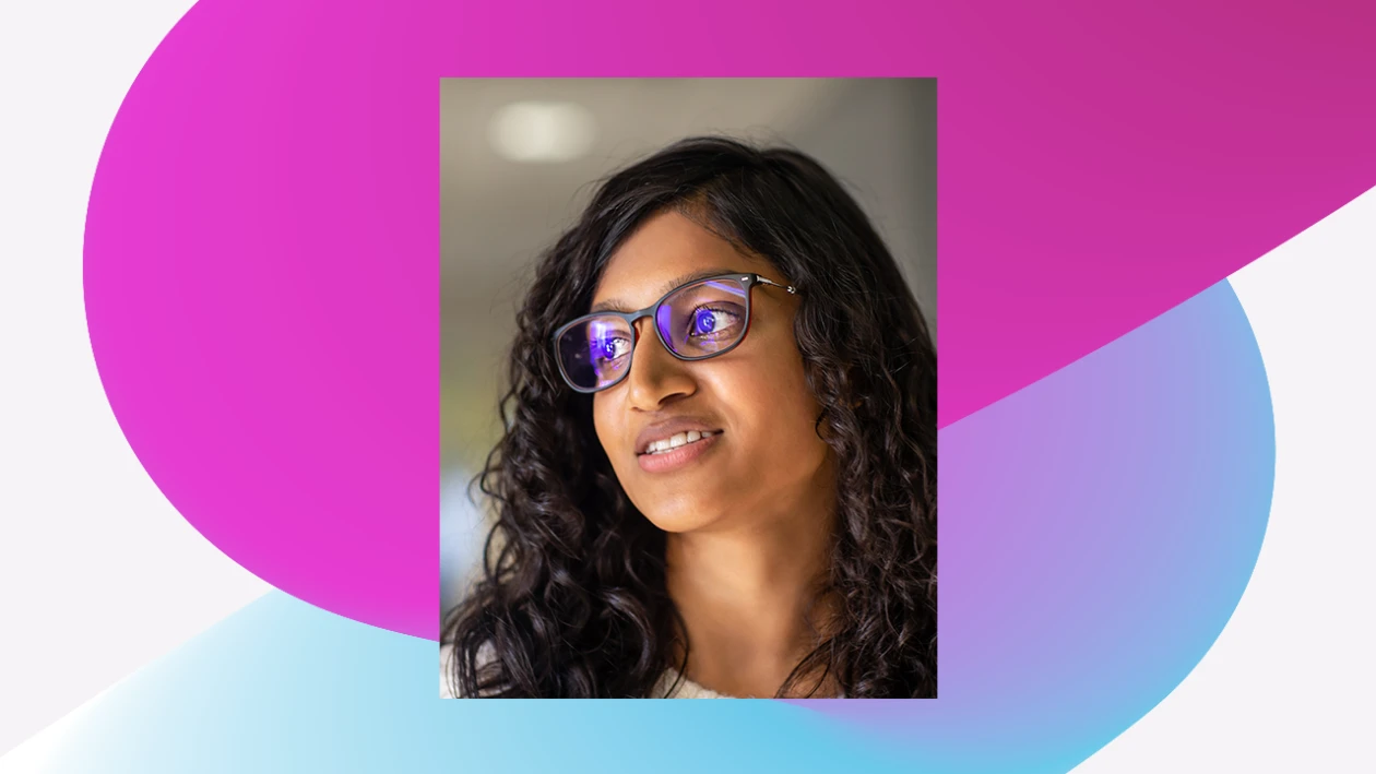 Close-up of a person with long brunette hair wearing glasses looking to the side. The image is overlaid on a magenta and blue gradient squiggle graphic design background