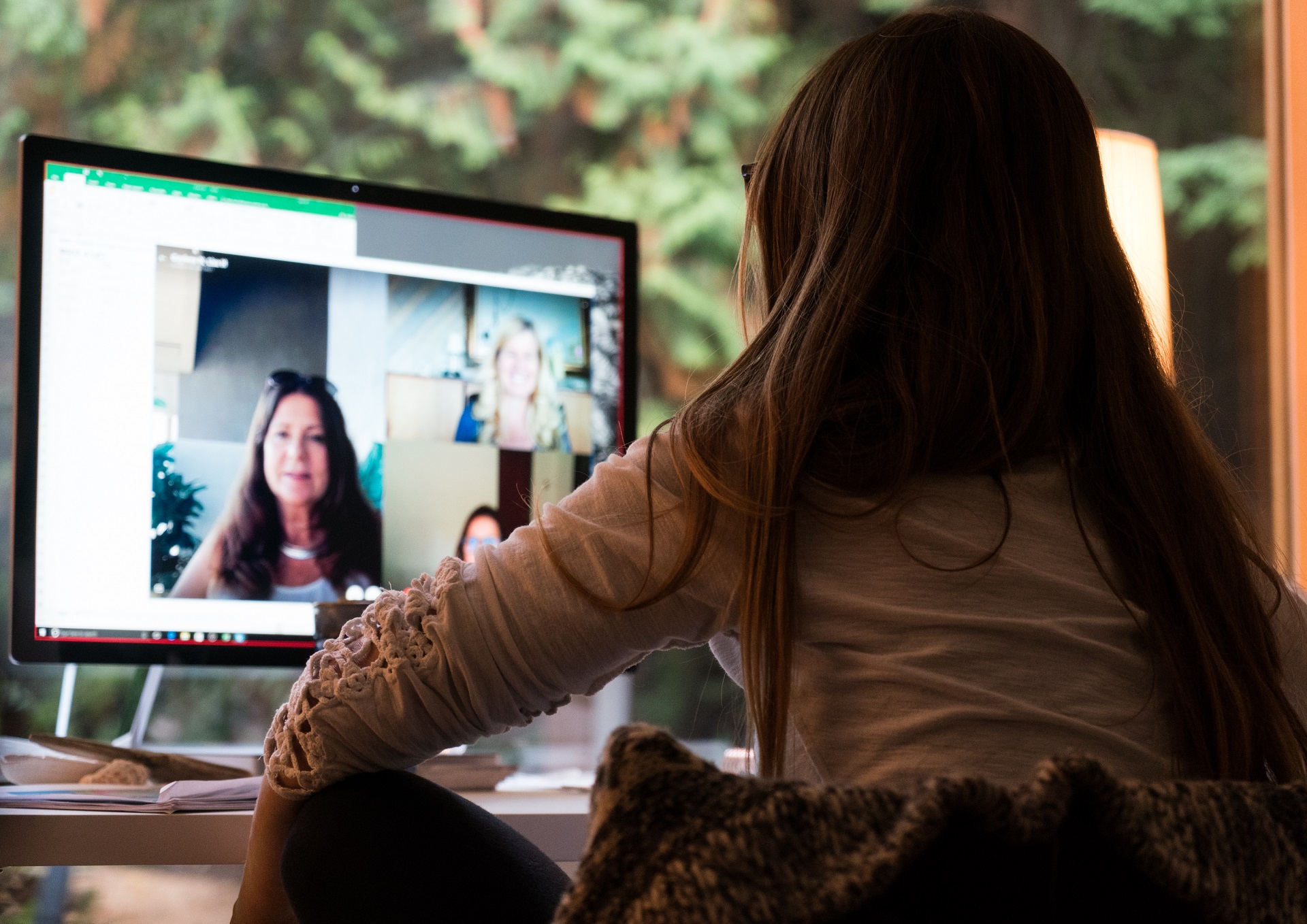 a person standing in front of a computer