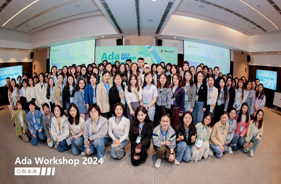 a group of people standing in front of a crowd posing for the camera