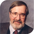 Edmund M. Clarke wearing glasses and smiling at the camera