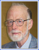 Tony Hoare wearing glasses and looking at the camera