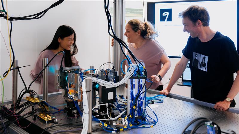 three Microsoft researchers working with the analog optical computer
