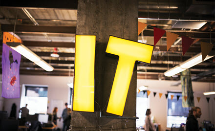 Image of a sign which reads IT