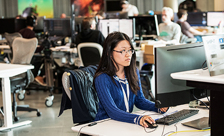 Image of a woman at her desk