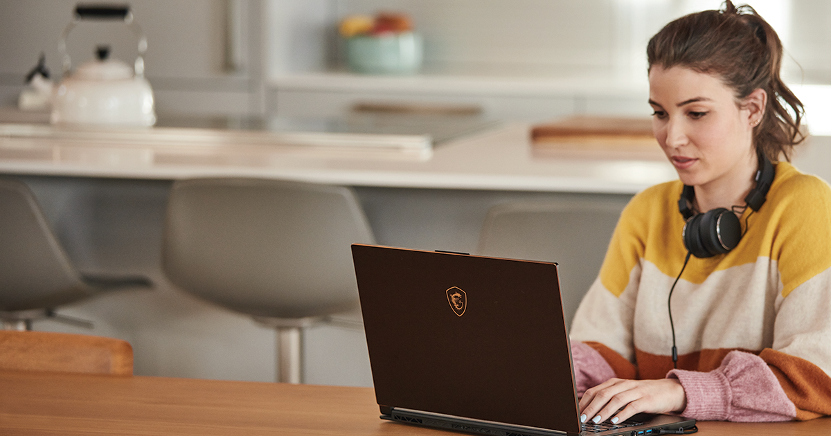 Image of a worker at her desk at home