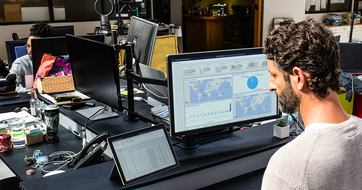 Image of a man working at his desktop PC