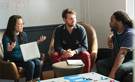 People holding a quick sync-up meeting