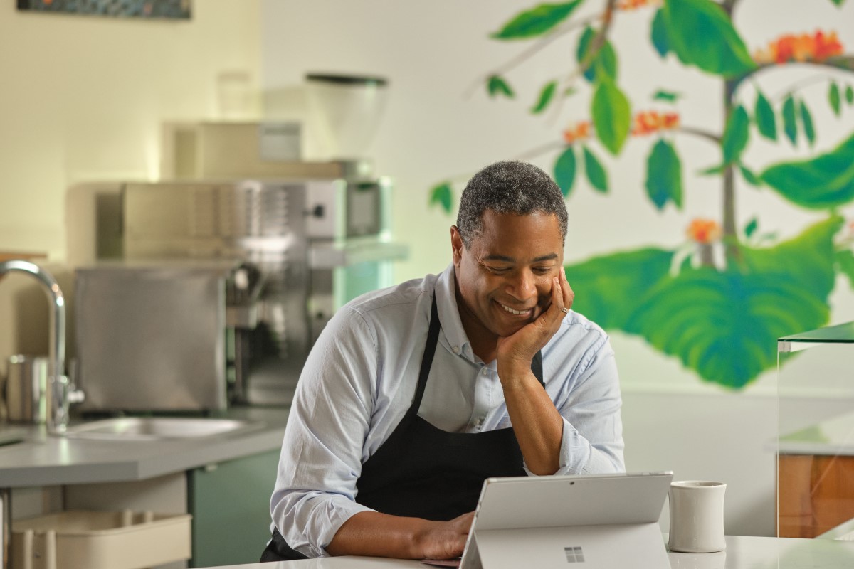 Restaurant owner working behind counter