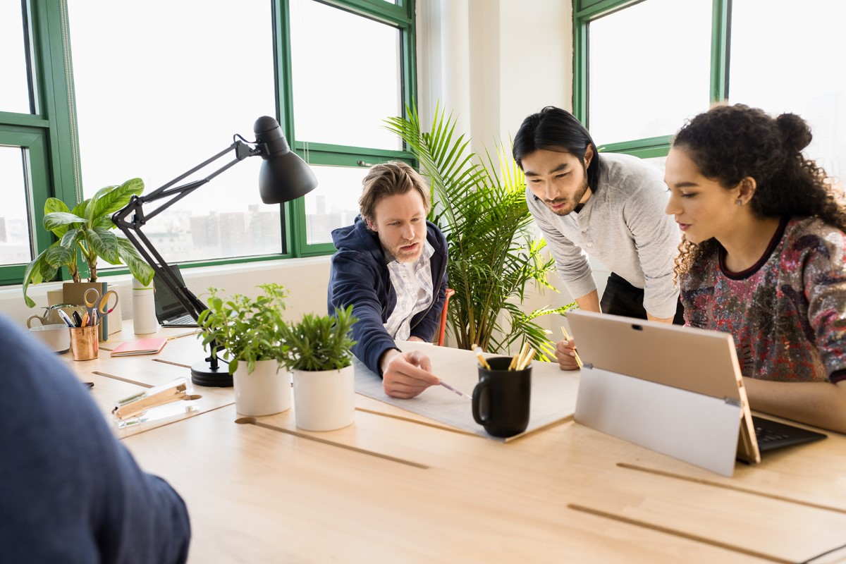 Small business team collaborating in modern workplace