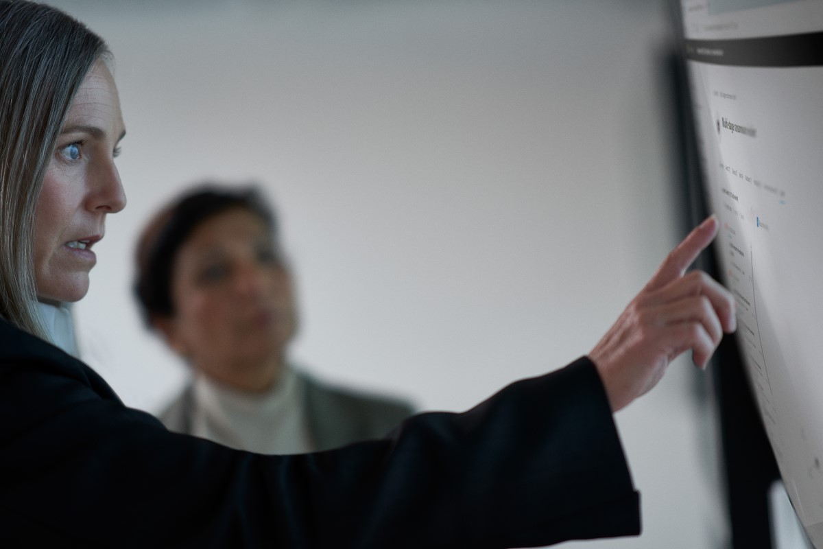 C I S O collaborating with a practitioner in a security operations center
