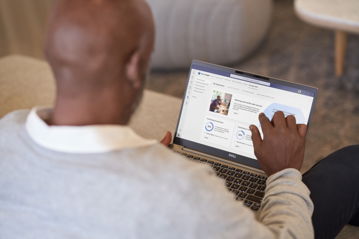 Employee reviewing his organization&lsquo;s Viva Insights while working from home on his laptop​