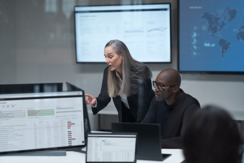 Practitioner and chief information security officer collaborating in a security war room