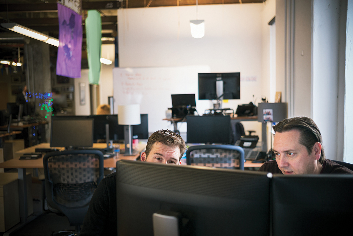 IT professionals at a digital consulting firm. The firm provides custom solutions across a multitude of disciplines including IT, front and back end software development, customer support and data services