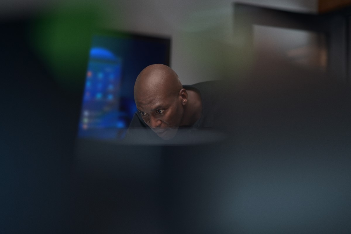 Close-up view of focused chief information security officer at work in a security operations center