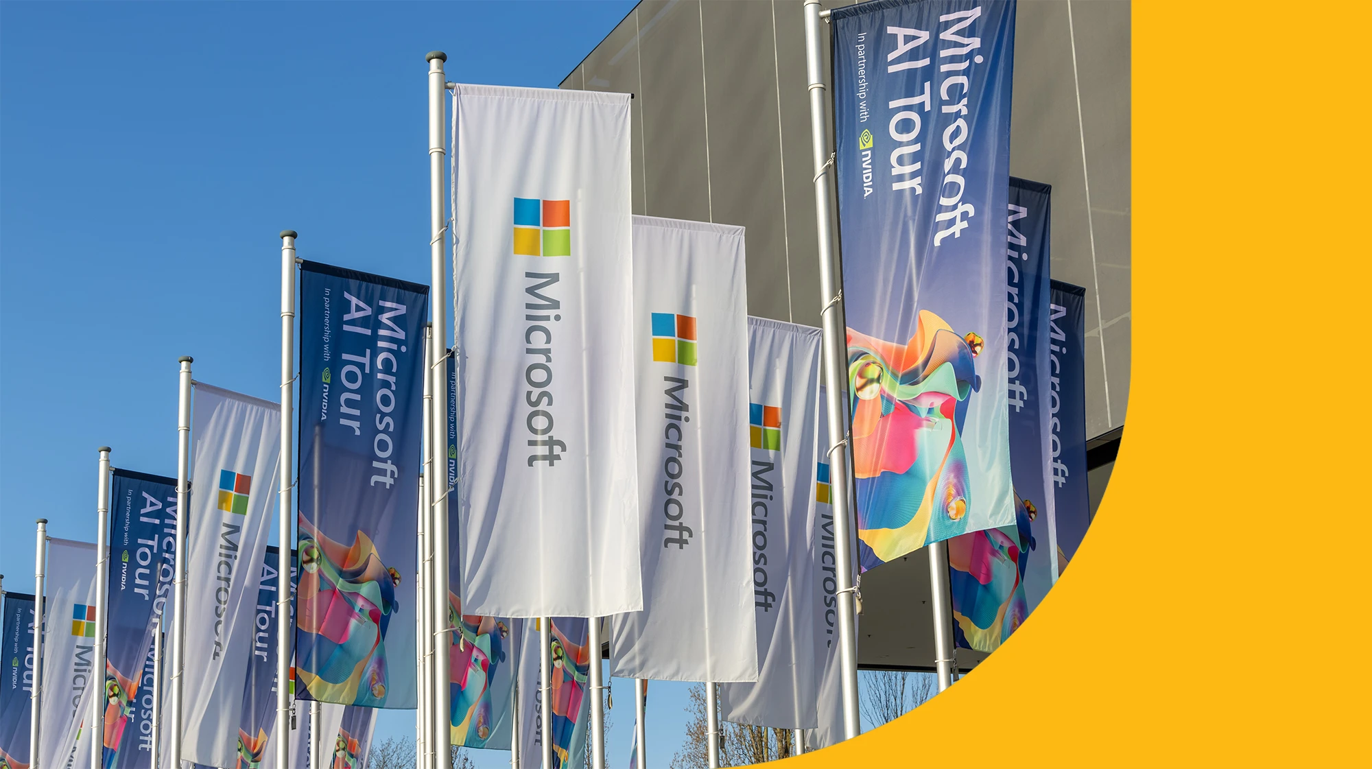 A group of flags advertising the Microsoft AI tour
