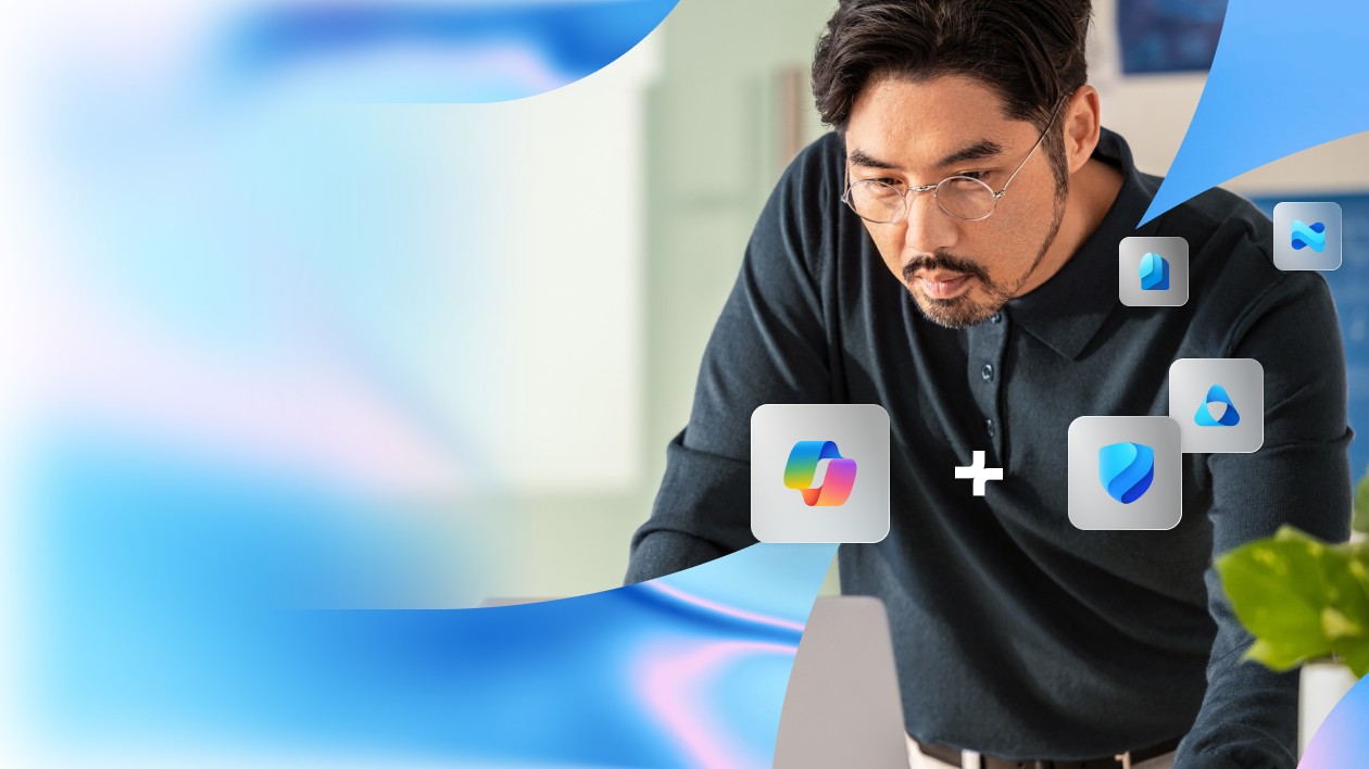 A person leaning over a desk, surrounded by floating icons of Microsoft Loop and Microsoft Defender, with abstract blue and white swirls in the background, suggesting collaboration between these tools
