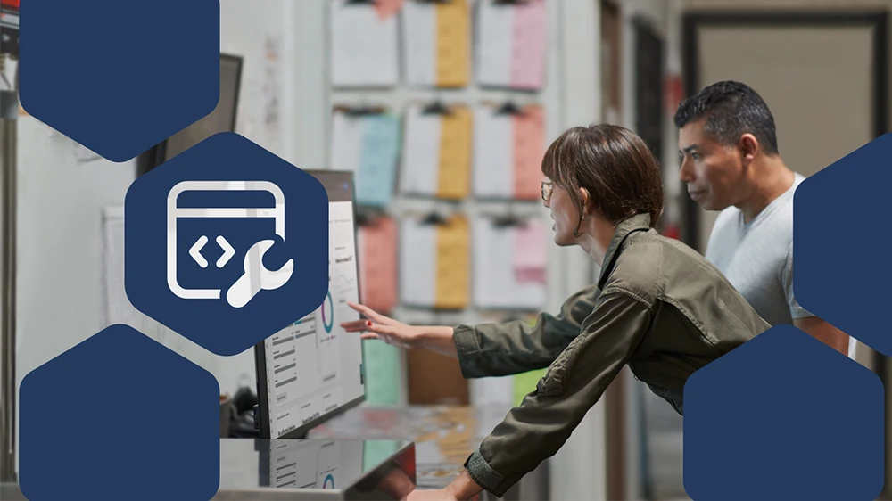 Photo of CEO and COO at a manufacturing company reviewing security reports