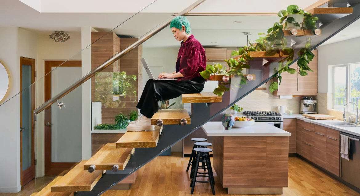 a person that is standing in the kitchen
