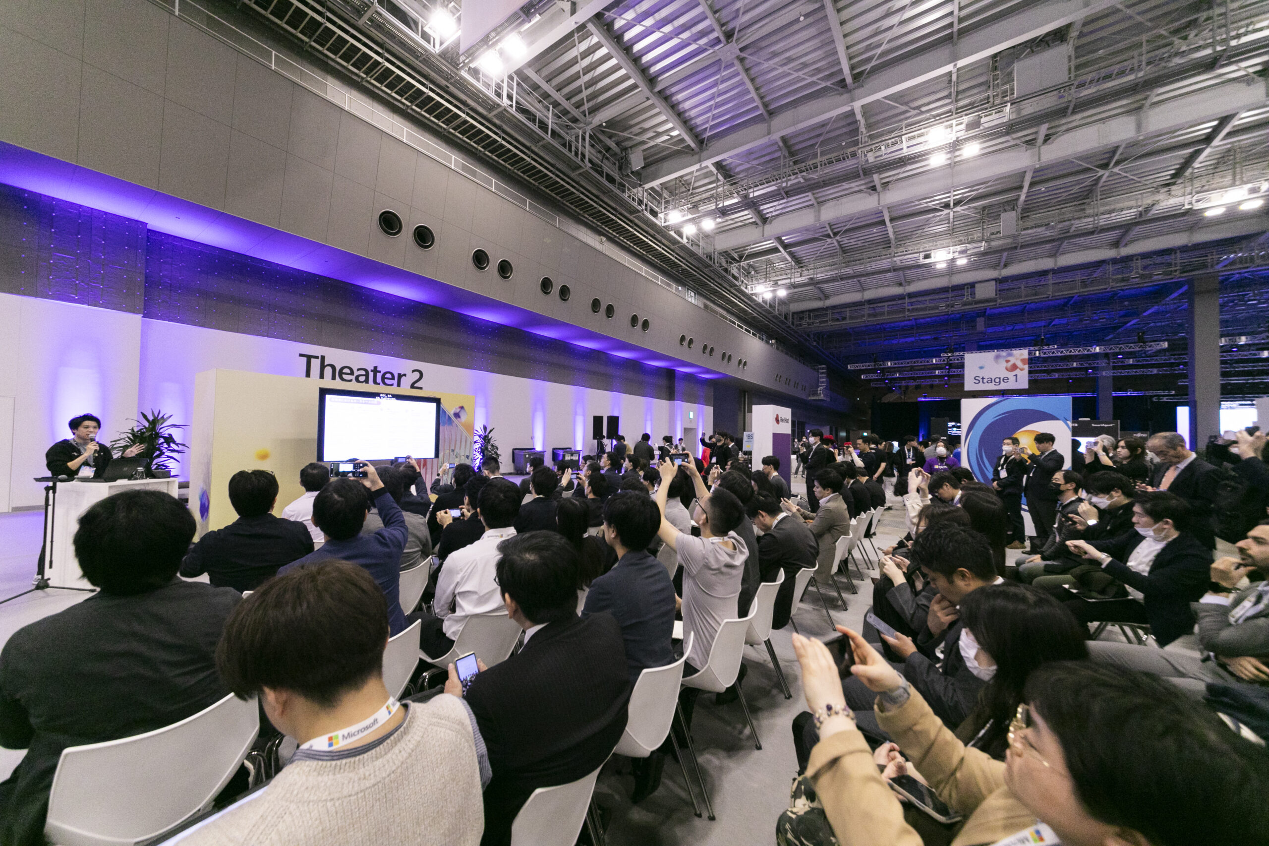 A group of people sitting in chairs in a room